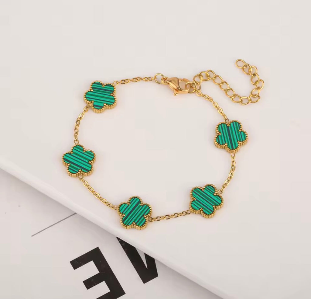 Le bracelet double face en acier inoxydable avec pétales de cinq feuilles et trèfles plaqués or